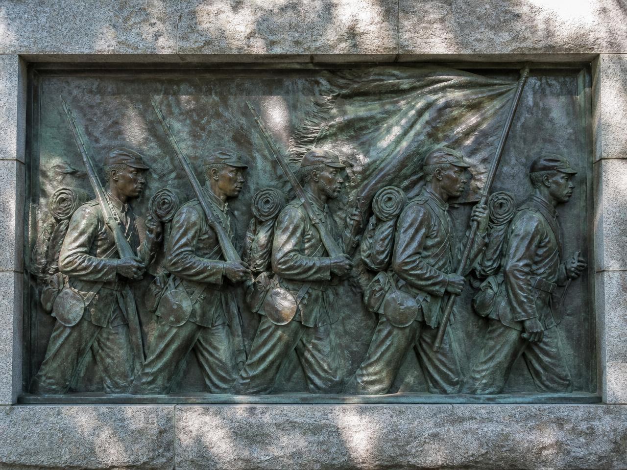 Bronze bas-relief memorial depicting marching African American Union soldiers of the 54th Massachusetts Regiment.